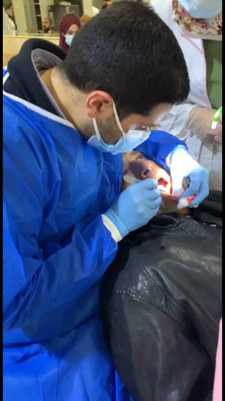 The procedure for opening the gums in dental clinics at Al-Mustaqbal University College.