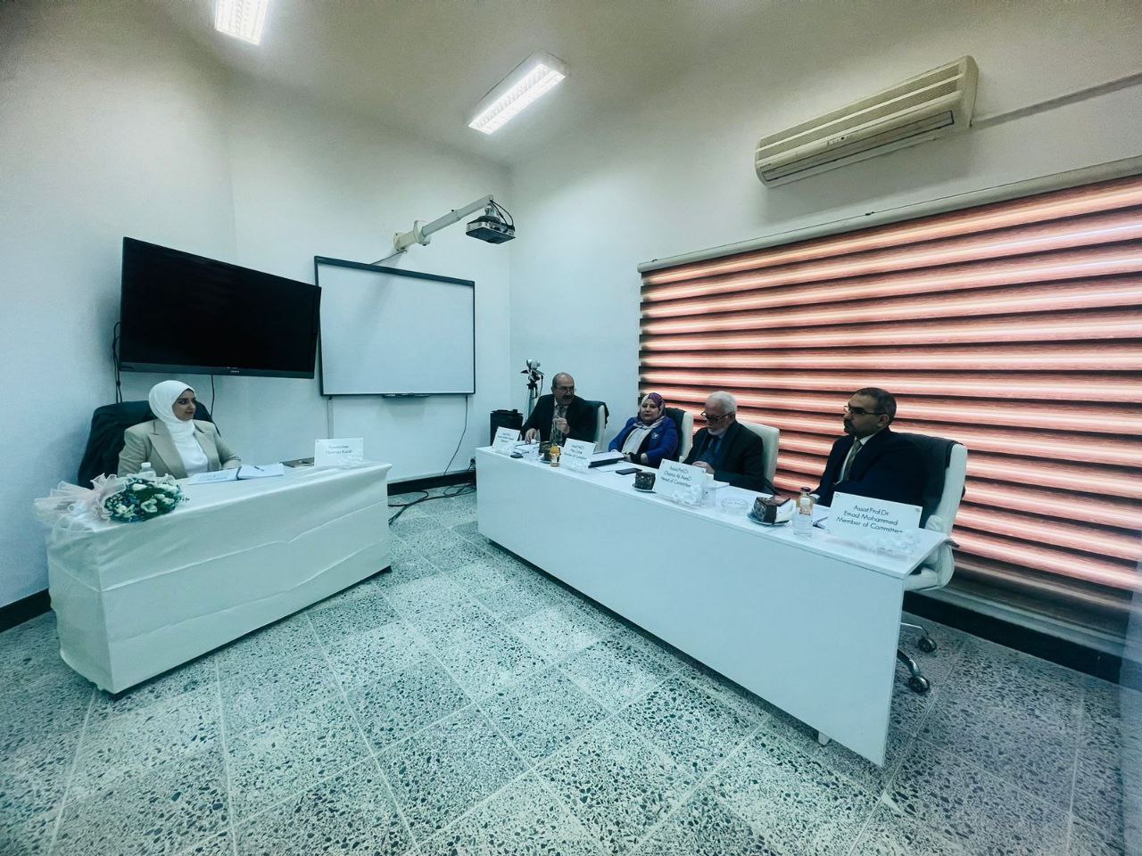 A.M.D. Osama Ali Awad chairs a public discussion committee at Al-Nahrain University